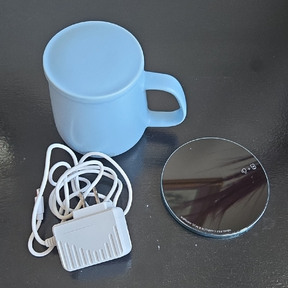 Sky Blue Ceramic Mug with Black Wireless Charging Pad and White Charger